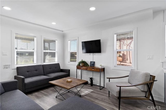 living area featuring a wealth of natural light, recessed lighting, and wood finished floors