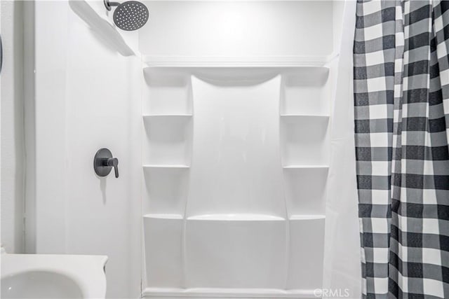 bathroom with a shower with curtain