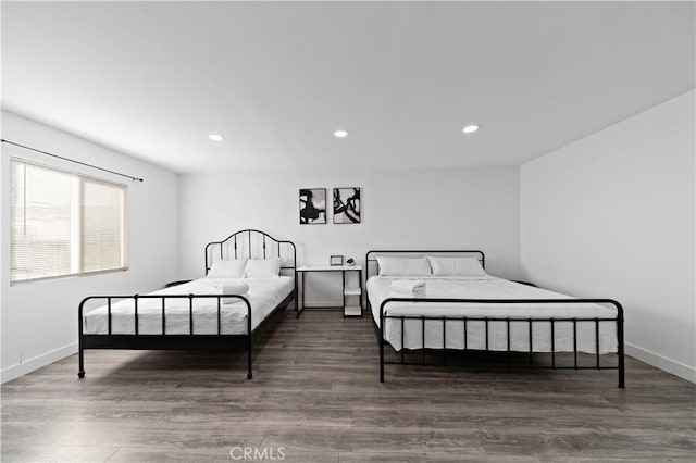 bedroom featuring recessed lighting, baseboards, and wood finished floors