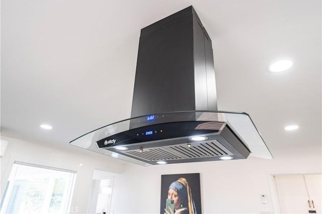 details with recessed lighting and island range hood