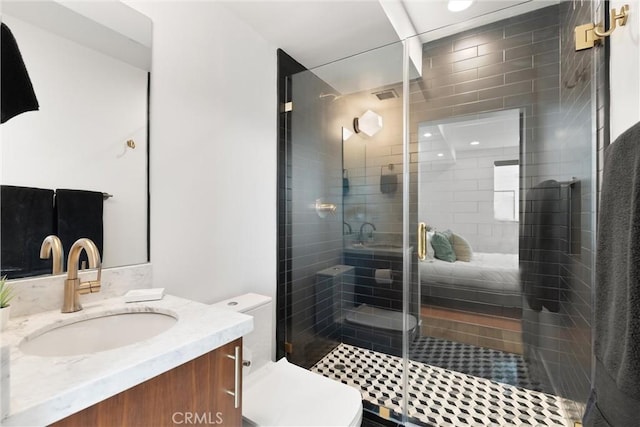 full bathroom with visible vents, vanity, a shower stall, and toilet