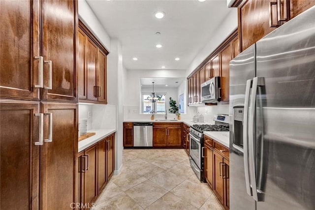 kitchen with brown cabinetry, recessed lighting, a sink, stainless steel appliances, and light countertops