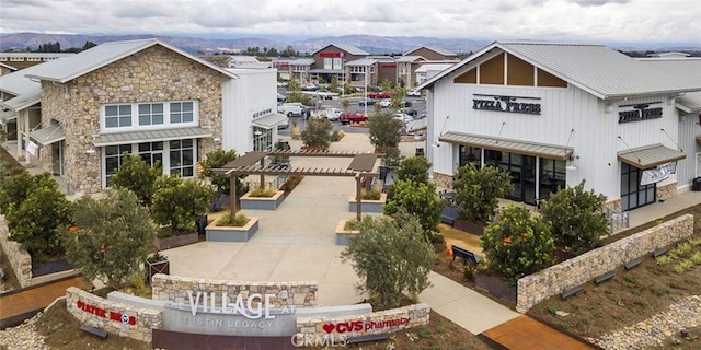 birds eye view of property featuring a mountain view