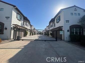 view of gate with a residential view