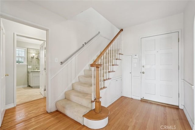 stairway with wood finished floors