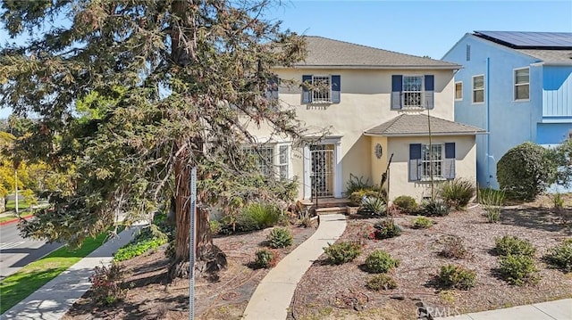 view of front of house featuring stucco siding