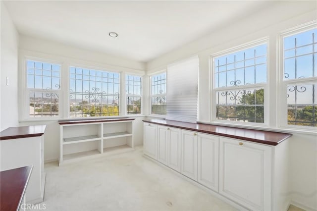 unfurnished sunroom featuring a wealth of natural light