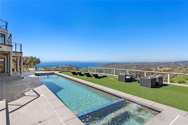 view of pool with an outdoor hangout area, a lawn, an in ground hot tub, and a patio area