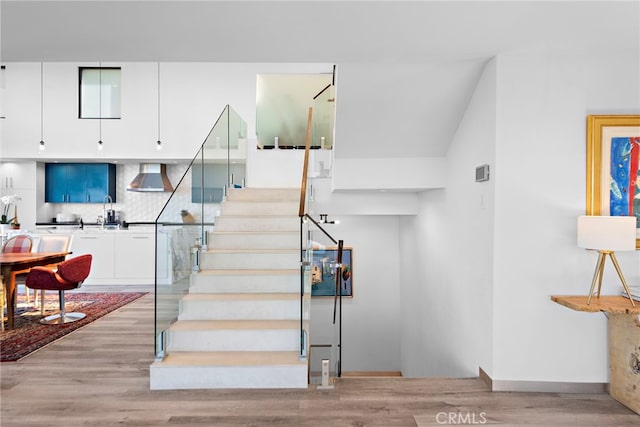 stairway with wood finished floors