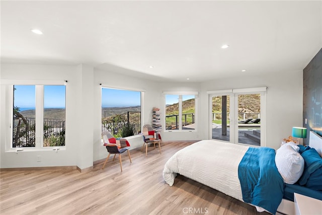 bedroom featuring recessed lighting and light wood finished floors