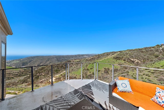 balcony featuring a mountain view