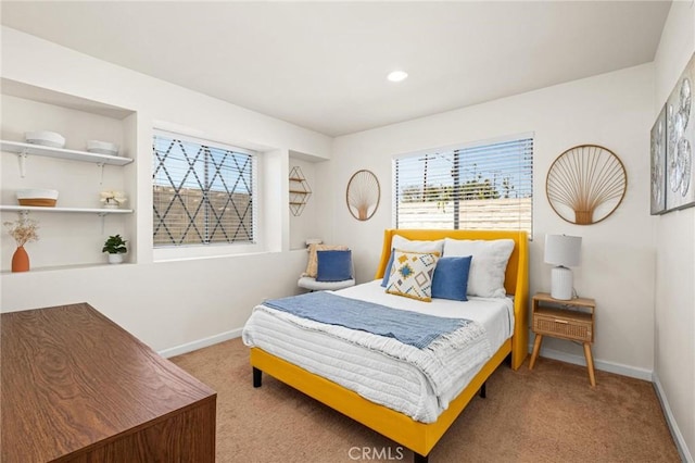 carpeted bedroom with baseboards