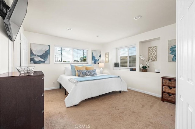 carpeted bedroom featuring multiple windows, recessed lighting, and baseboards