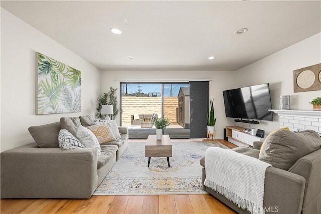 living area featuring recessed lighting and wood finished floors