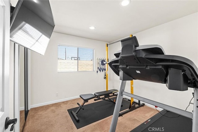 workout area featuring recessed lighting, baseboards, and carpet