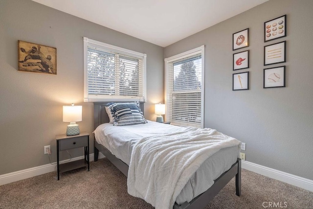 bedroom featuring baseboards and carpet flooring