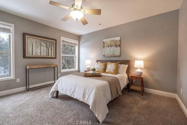 carpeted bedroom featuring baseboards and ceiling fan