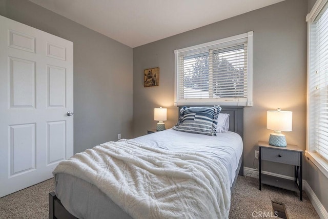 bedroom with visible vents, baseboards, and carpet flooring