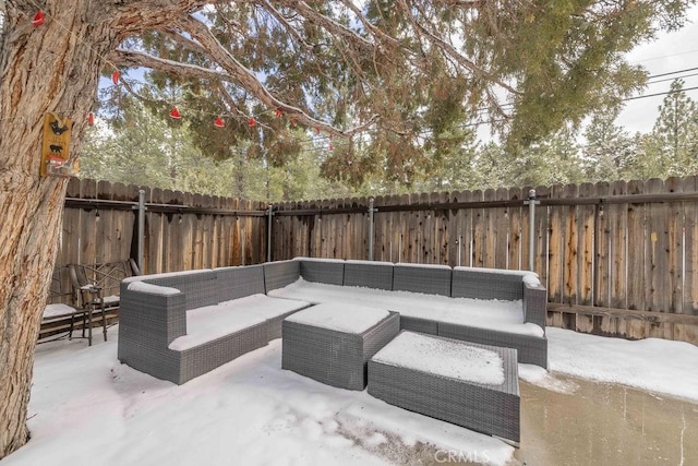 view of patio / terrace with an outdoor living space and a fenced backyard