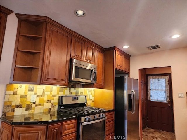 kitchen with open shelves, stainless steel appliances, visible vents, and decorative backsplash