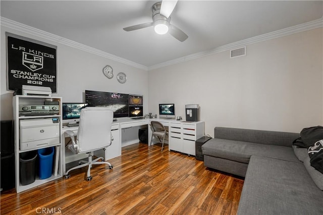 office with visible vents, ornamental molding, and wood finished floors