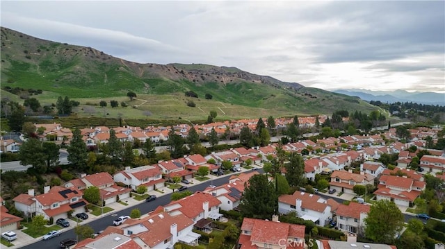 aerial view featuring a mountain view and a residential view