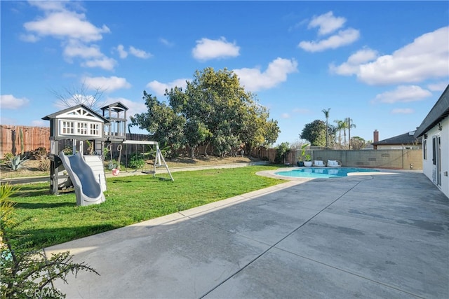 view of pool with a lawn, a patio, a fenced backyard, a playground, and a fenced in pool