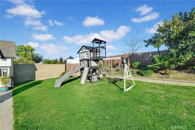 view of play area with a yard and a fenced backyard