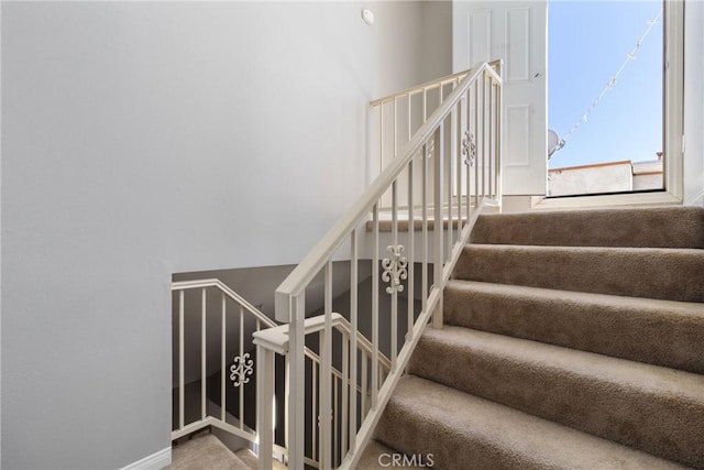 14039 Astoria St Unit 120, Sylmar, CA 91342 - staircase featuring baseboards