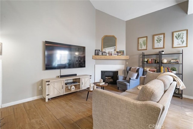 14039 Astoria St Unit 120, Sylmar, CA 91342 - living room with a fireplace and wood finished floors