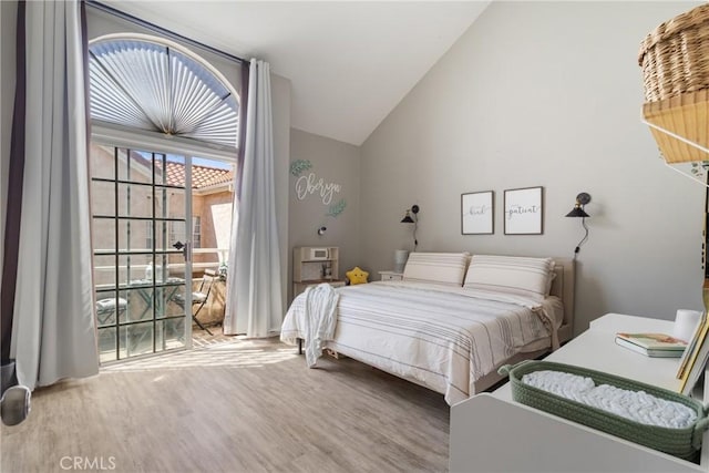 14039 Astoria St Unit 120, Sylmar, CA 91342 - bedroom with wood finished floors and vaulted ceiling