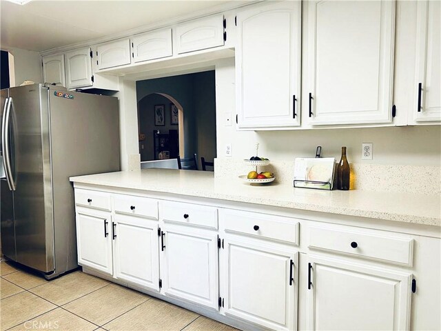 14039 Astoria St Unit 120, Sylmar, CA 91342 - kitchen with freestanding refrigerator, light countertops, and white cabinetry