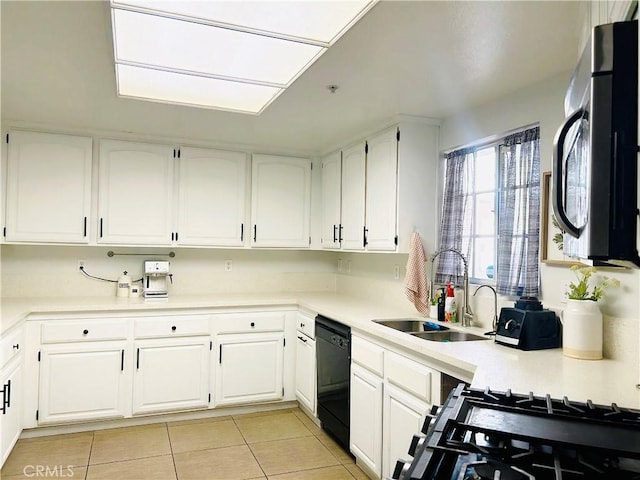 14039 Astoria St Unit 120, Sylmar, CA 91342 - kitchen featuring black appliances, light tile patterned floors, and white cabinets