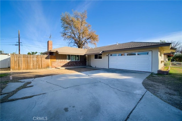 single story home with driveway, fence, a garage, brick siding, and a chimney