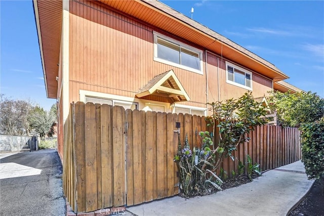 view of home's exterior featuring fence