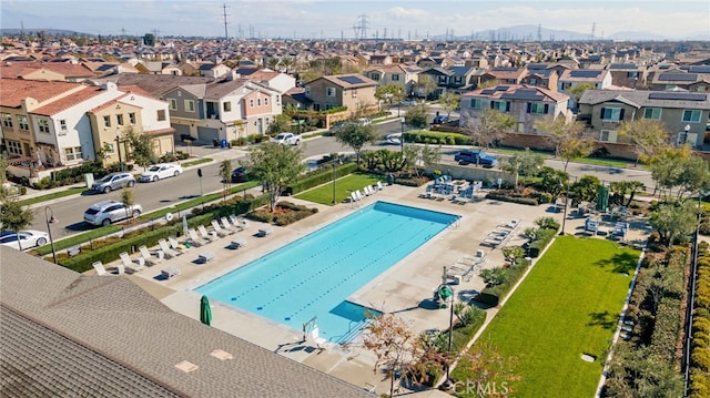 view of swimming pool with a residential view