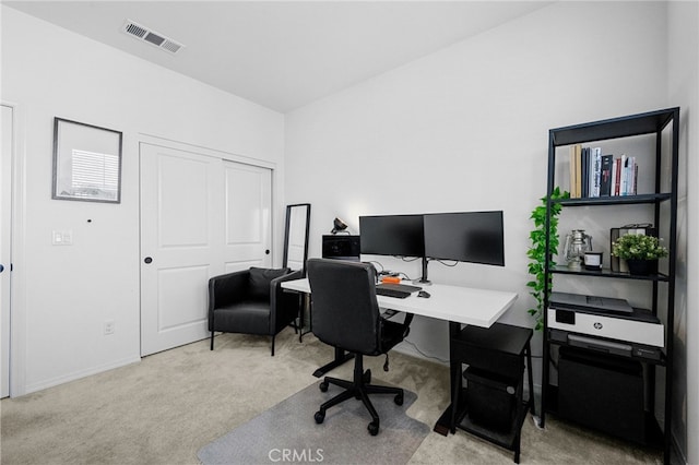 carpeted office space featuring visible vents