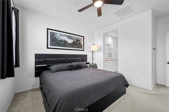 bedroom with visible vents, light carpet, and baseboards