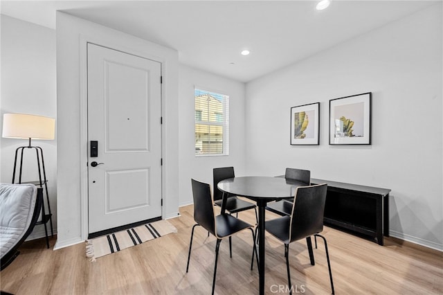 dining room featuring recessed lighting, light wood-style floors, and baseboards