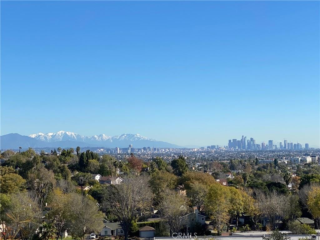 property view of mountains featuring a city view