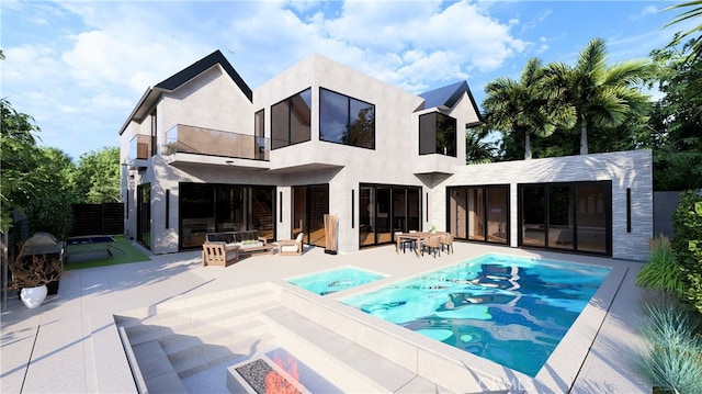 back of house with stucco siding, an outdoor living space, fence, a balcony, and a patio area