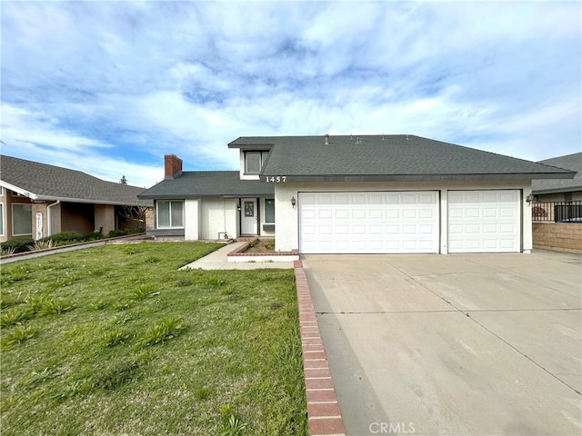 view of front of property featuring an attached garage, a front lawn, stucco siding, a chimney, and driveway