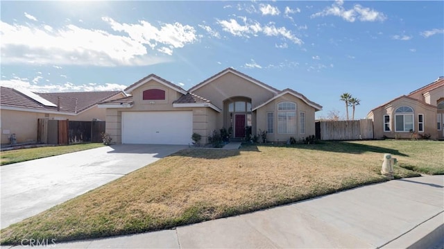 single story home featuring stucco siding, a front lawn, fence, concrete driveway, and an attached garage