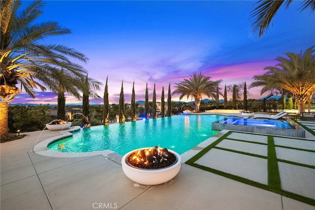 view of pool featuring a patio and an infinity pool