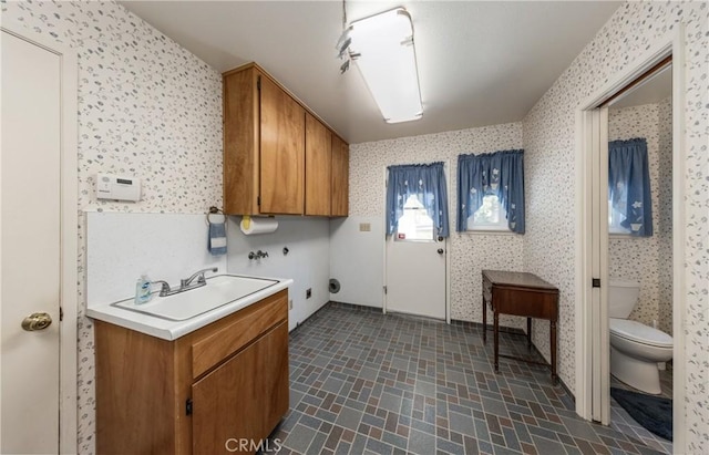 23187 Glendora Dr, Grand Terrace, CA 92313 - clothes washing area featuring wallpapered walls, cabinet space, and hookup for a washing machine