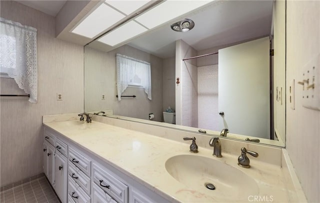 23187 Glendora Dr, Grand Terrace, CA 92313 - full bathroom featuring toilet, a shower, tile patterned flooring, and double vanity