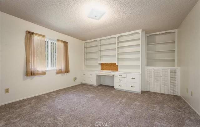 23187 Glendora Dr, Grand Terrace, CA 92313 - unfurnished office featuring carpet floors, a textured ceiling, and baseboards