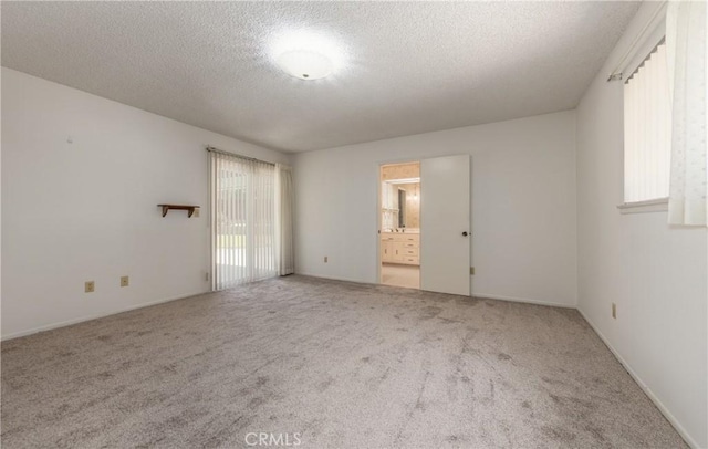 23187 Glendora Dr, Grand Terrace, CA 92313 - empty room with carpet flooring and a textured ceiling