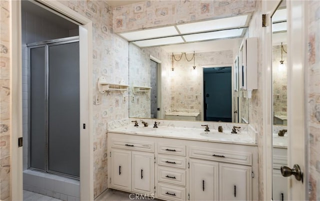 23187 Glendora Dr, Grand Terrace, CA 92313 - full bathroom featuring wallpapered walls, a stall shower, and double vanity
