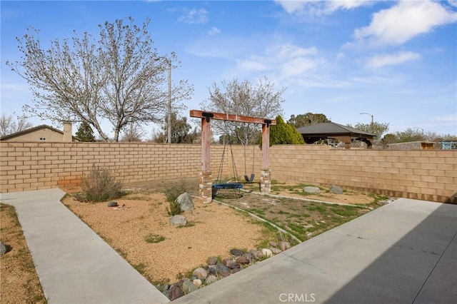 view of yard with a fenced backyard